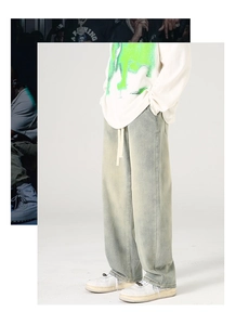 Détail du pantalon en jean délavé à coupe large avec taille à cordon et style rétro