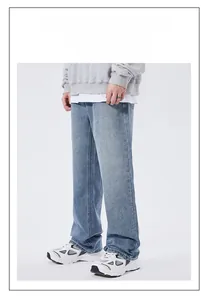 Detailed view of light blue washed denim jeans for men with relaxed straight leg fit