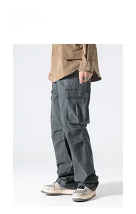 Full view of American high street cargo pants with large side pockets and cotton twill texture
