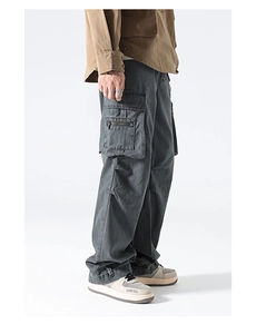 Macro detail of high street cargo pants featuring multi-pocket design and durable fabric