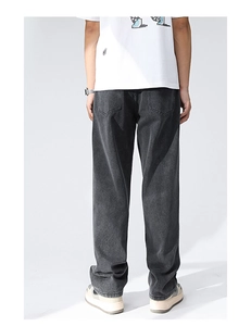 Rear view of loose fit charcoal grey denim jeans with vintage wash and pocket detail