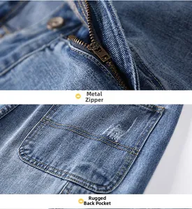 Detail of metal zipper and scratch-pattern back pocket on blue washed denim jeans
