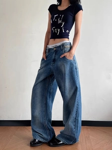 Retro loose-fit blue washed denim jeans with a wide-leg cut and vintage aesthetic