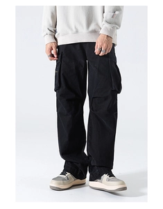 Detail view of black multi-pocket cargo pants with wide-leg straight cut and flap pockets