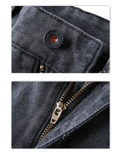 Detailed close-up of high-quality YKK metal zipper and engraved button on denim pants