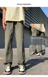 Detail of army green cargo pants with multi-pocket design and loose straight fit for men
