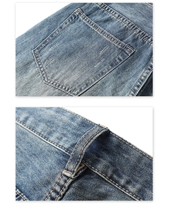 Détail des poches en denim bleu vintage avec coutures contrastées et bords vieillis à la main