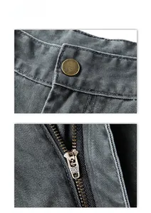 Detail view of high-street cargo pants featuring a YKK metal zipper and brass button fly