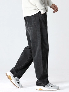 Men's relaxed fit washed black denim jeans featuring a wide leg and casual streetwear style