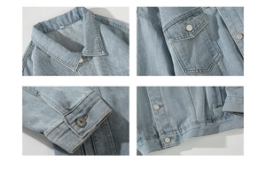 Detail view of light blue denim jacket featuring metal buttons and fabric texture
