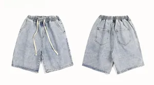 Front and back view of light blue denim shorts with elastic waist and drawstring