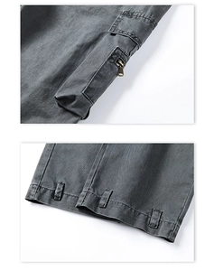Detailed view of cargo pants with zip side pockets and adjustable hem webbing straps
