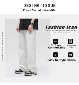 Detail view of white wide-leg cotton jeans showing high waist cut and loose straight fit