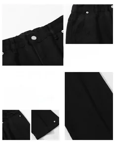 Detail view of black cotton casual pants featuring elastic waist and metal button