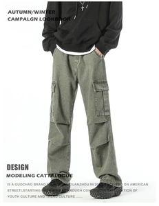 Detailed macro view of olive green cargo pants featuring large side pockets and loose fit