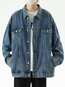 Classic mid-blue oversized denim jacket with vintage wash and chest flap pockets
