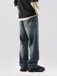 Jean bleu large à coupe droite style streetwear américain délavé pour hommes vue de dos