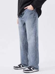 Men's loose light blue washed straight-leg denim jeans shown on a model side view