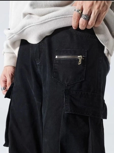 Men's high street cargo pants in black cotton featuring multiple utility pockets