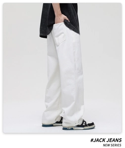 Detail view of white wide-leg cotton denim jeans with back pocket and clean side stitching
