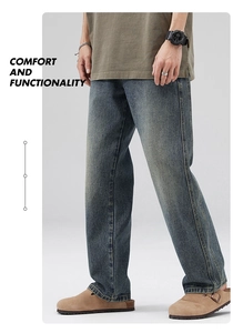 Close-up of men's straight leg jeans in blue wash with cat whiskers and yellow stitching