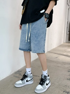 Relaxed light blue drawstring denim shorts for men with vintage washed finish and loose fit