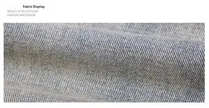 Macro view showing high-density twill weave and texture of light blue denim fabric