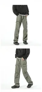 Detail of vintage olive green cargo jeans featuring large side pockets and knee pleats