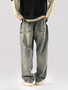 Jean vintage homme coupe large délavée avec boucle de charpentier et poches arrière