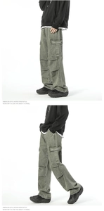 Close-up of vintage cargo jeans showing multi-pocket design and washed green fabric texture