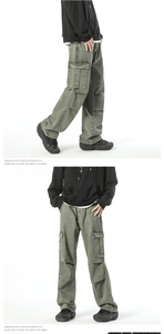 Detail view showing military green cargo jeans with multi-pocket design and straight leg cut