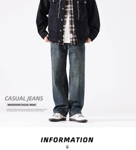 Detail view of American vintage washed denim jeans with bamboo texture and loose fit