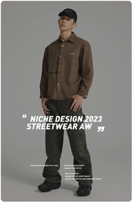 Detail of men streetwear outfit with brown suede shirt and dark camouflage cargo pants
