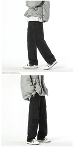 Detailed side view of black retro cargo pants featuring multiple large side pockets