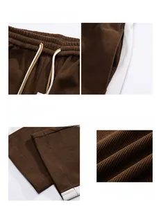 Detail of dark brown corduroy pants with white side stripes and drawstring waist