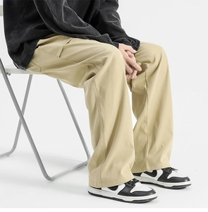 Detail of khaki wide-leg straight pants in retro style on a model with premium drape