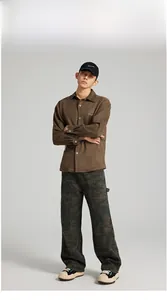 Detail of green camouflage cargo pants paired with a brown suede shirt for men
