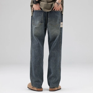 Vintage blue wide-leg denim jeans with heavy-duty washed texture and back pockets