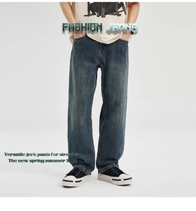 Detail of high street vintage wash loose straight jeans with retro distressed finish
