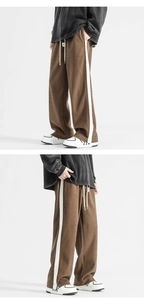 Detailed macro view of brown corduroy trousers with side stripes and elastic drawstring waist