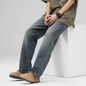 Men's vintage wash blue straight leg jeans styled in a Japanese workwear fashion look