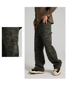 Detailed side view of camouflage cargo pants featuring tool loops and tactical side pockets