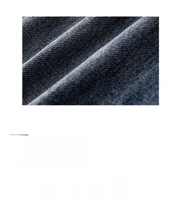 Close-up of heavy-duty navy blue twill denim fabric texture with breathable cotton details