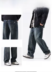 Detailed view of dark blue vintage wash denim with contrast stitching and loose fit