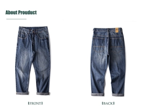 Flat lay detail showing the front and back of vintage blue washed wide-leg jeans