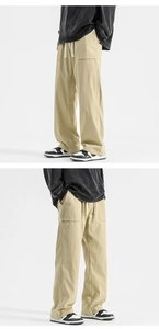 Macro detail of khaki loose-fit drawstring trousers with large functional cargo pockets
