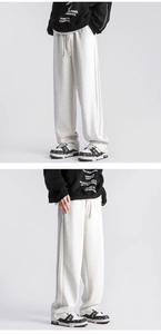Detail of oat grey loose straight sweatpants with adjustable white drawstring waist