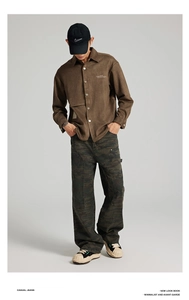Detail of men's American camouflage straight-leg cargo pants styled with a brown utility shirt