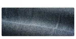 Macro close-up of blue and white lightning burst pattern twill denim fabric texture