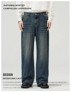 Detail of vintage blue washed denim fabric with natural whisker and faded texture